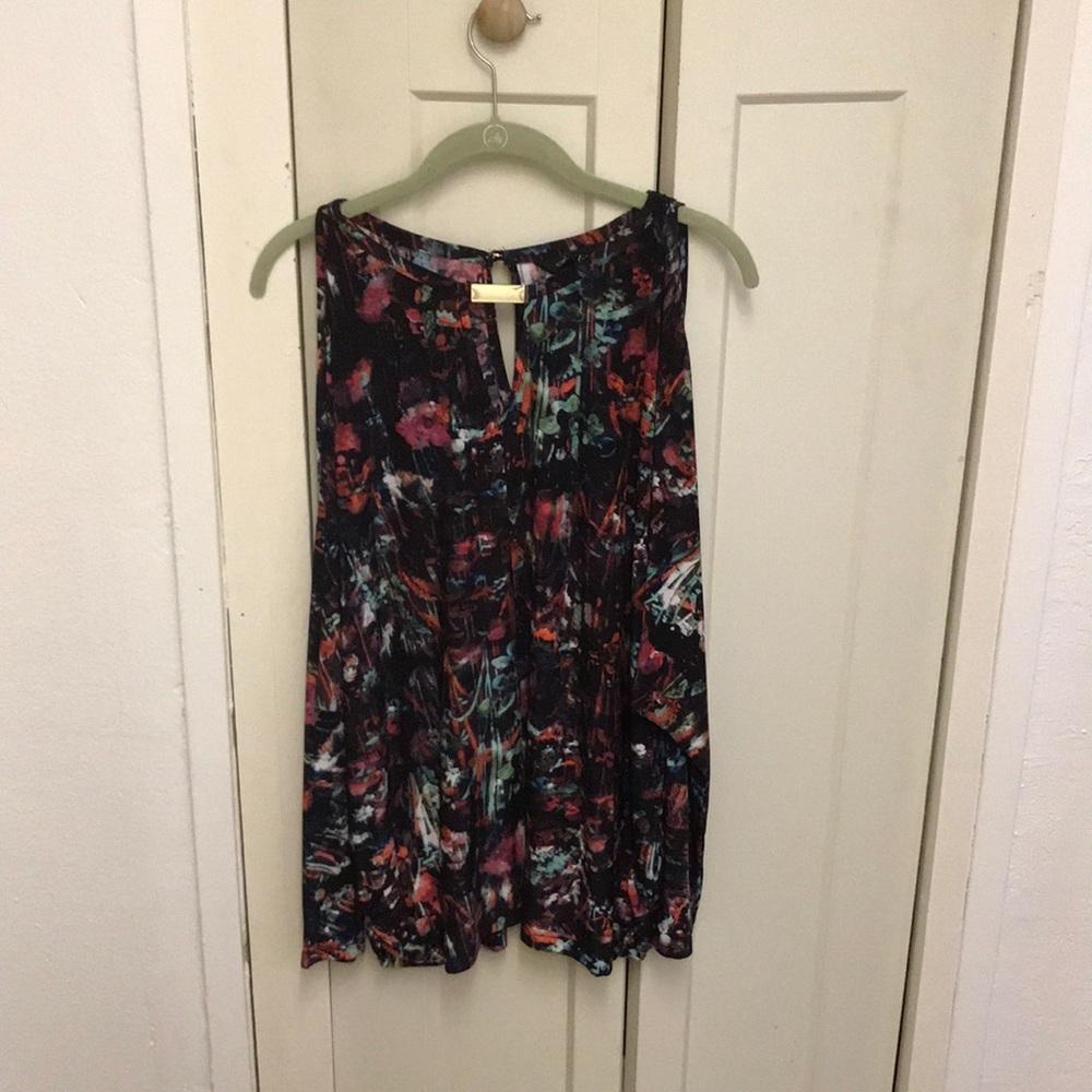 Long sleeve blouse with shoulder cut out.